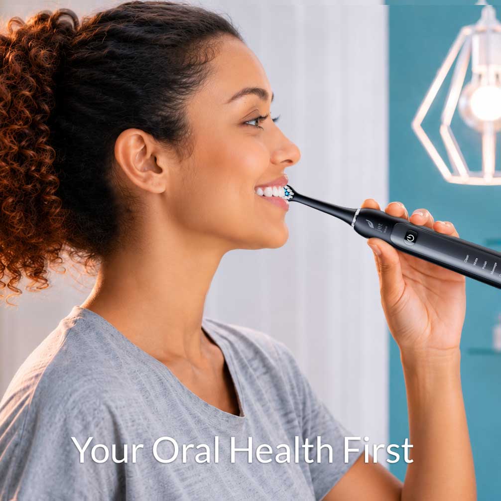 Woman using Acteh sonic electric toothbrush for daily oral care